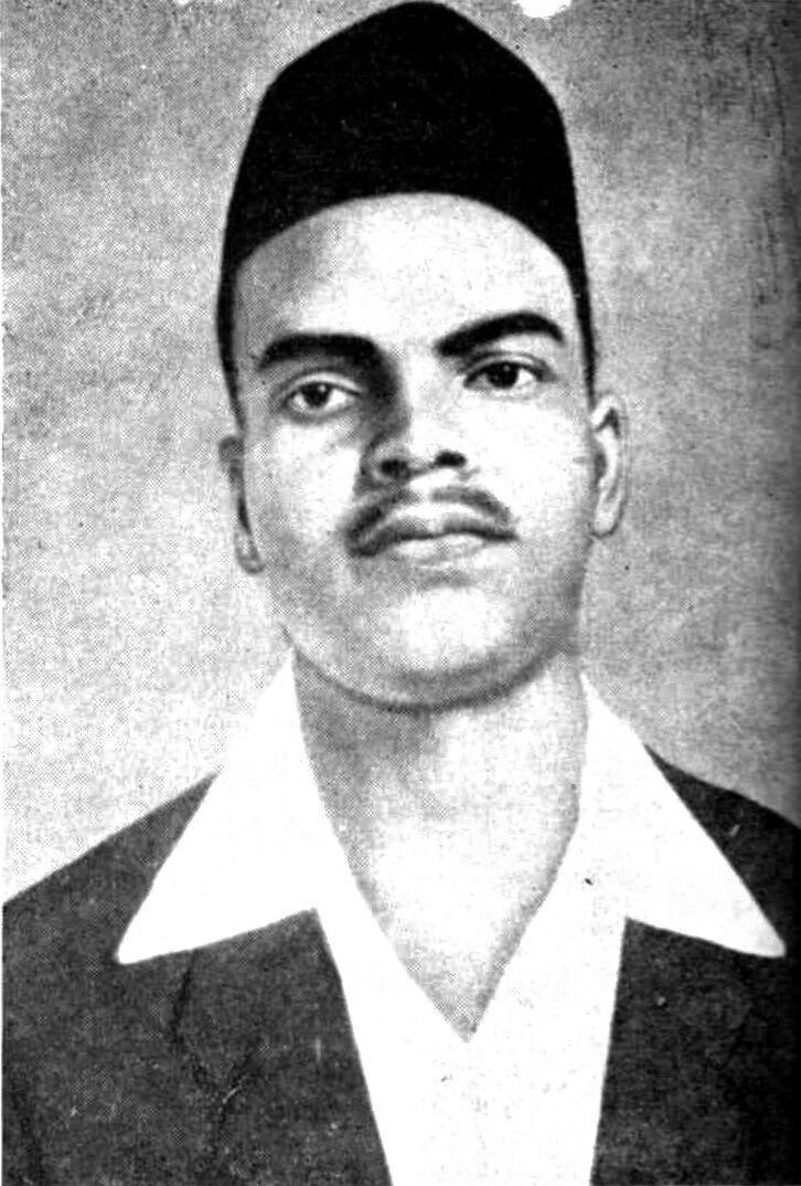 Archival black-and-white photographic portrait of Shivaram Hari Rajguru in a dark cap and light-collared jacket