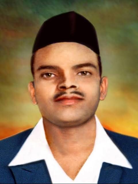 Colourised portrait of Shivaram Rajguru wearing a black cap, dark jacket and open white collar